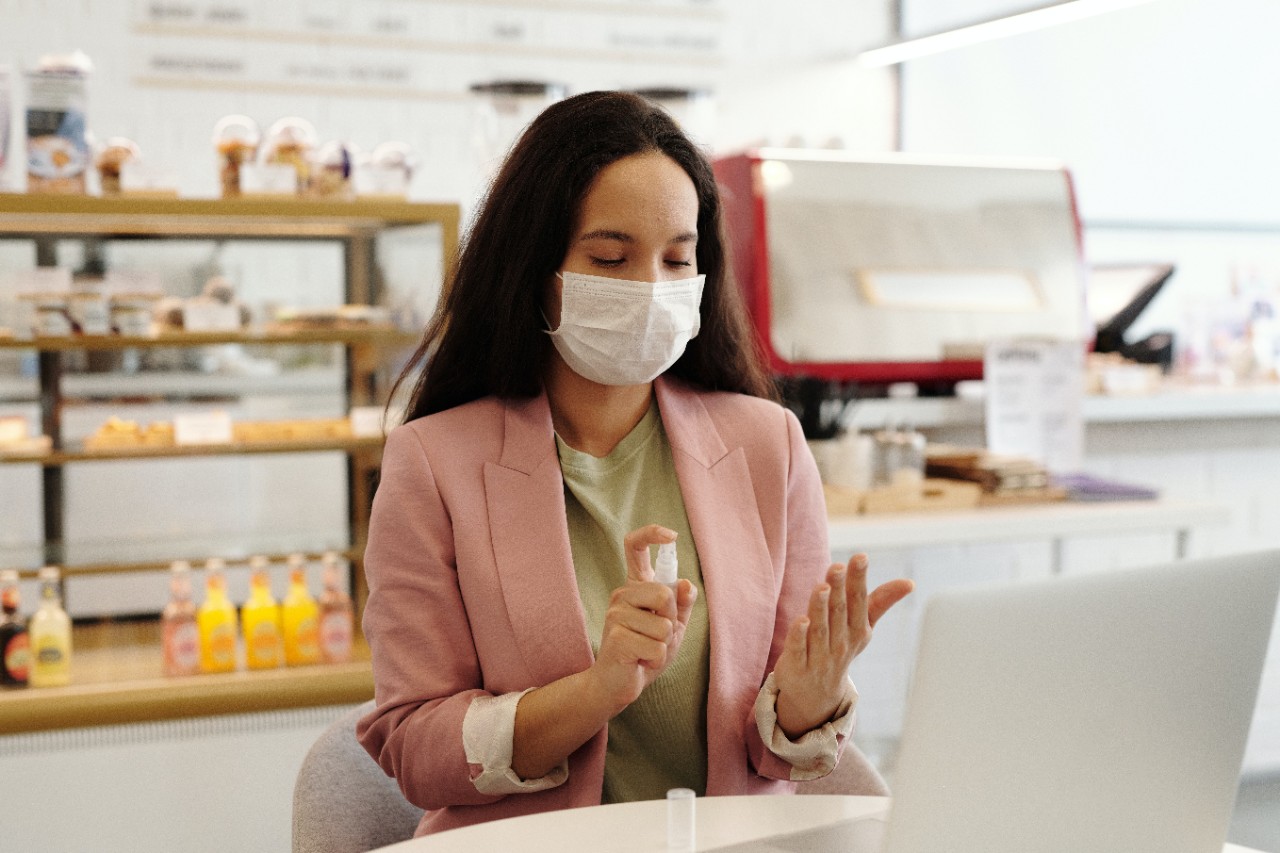 Woman with mask and sanitizer