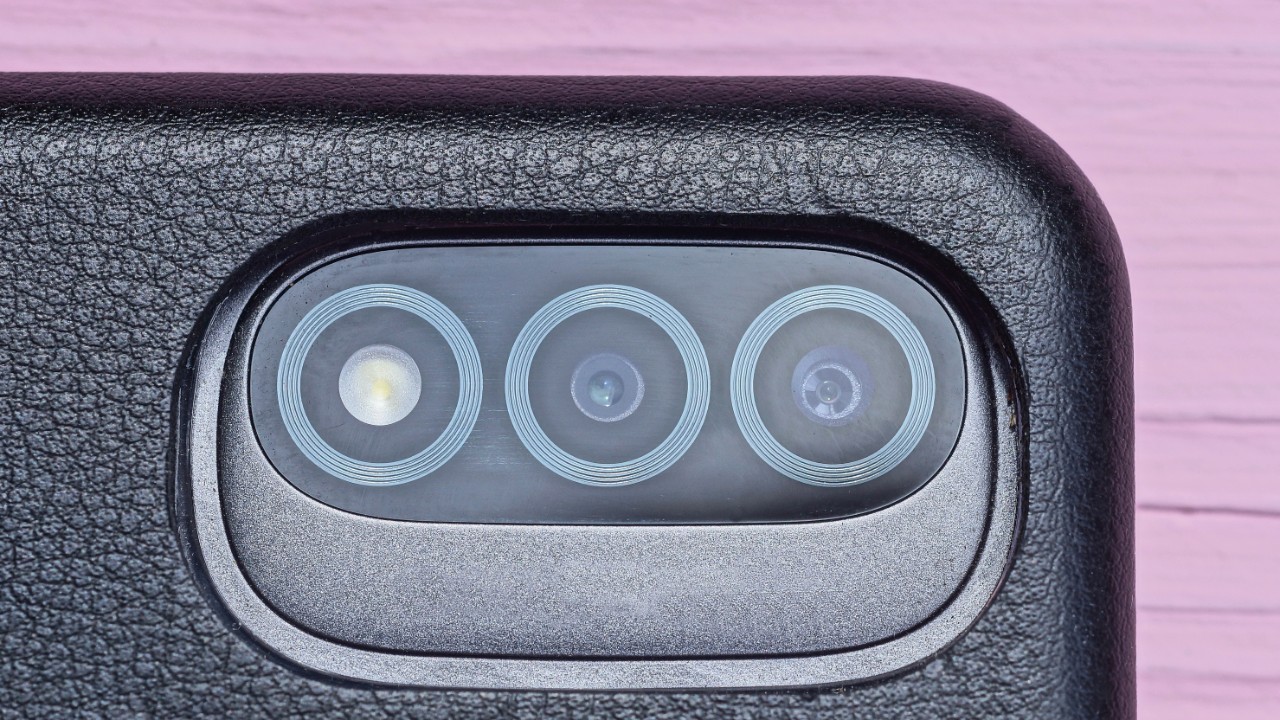 Closeup photo of a camera lens from a smartphone. We offer lens and glass bonding tape solutions for many electronic devices.