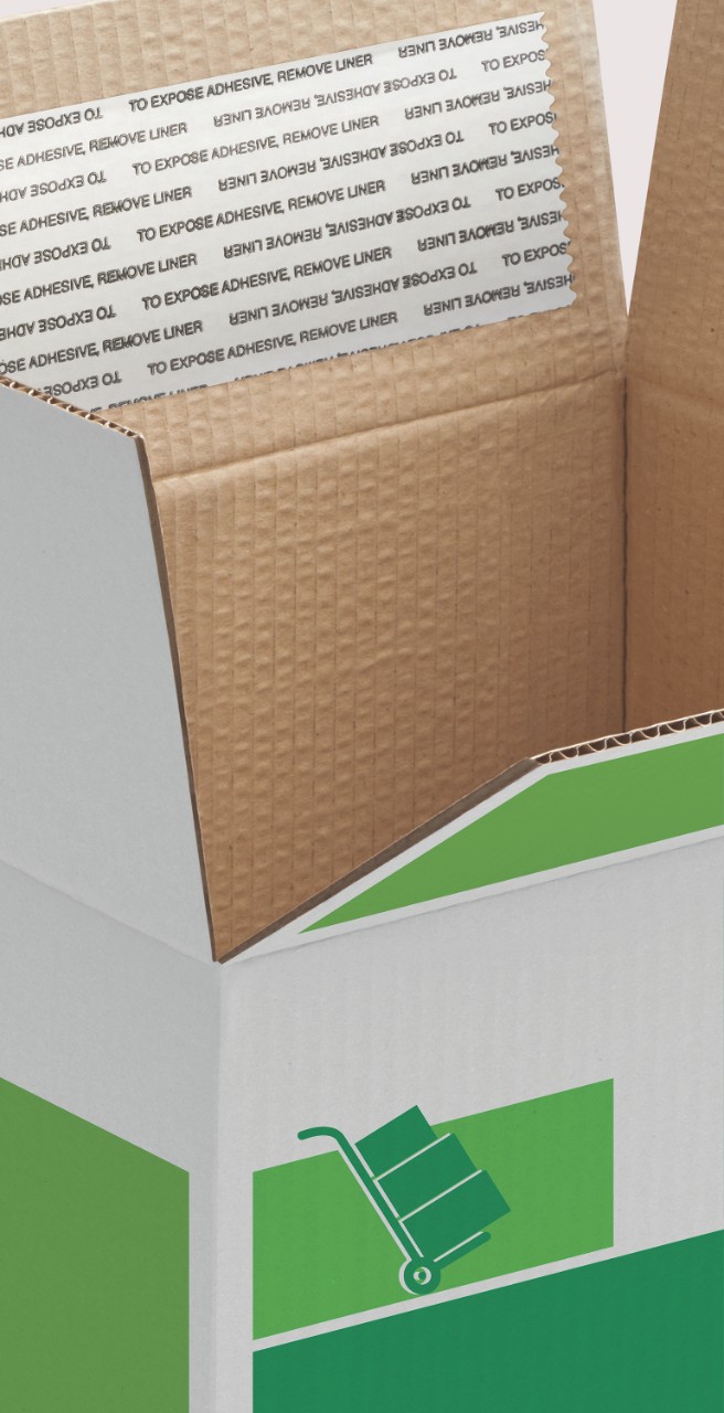 Photo of an open corrugated shipping contaner with a PSA tape visible on the flap. Our portfolio has many solutions for packaging.